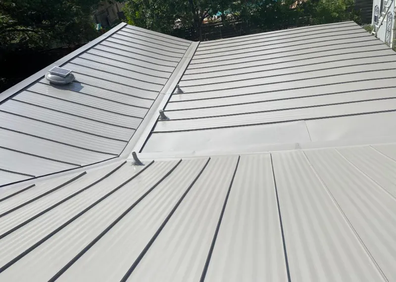 Solar attic fan installed on a metal roof for Roof Ventilation in Sun City